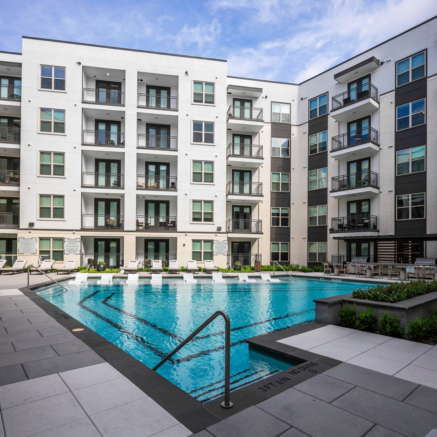 Outdoor deck and pool with barbecue social lounge