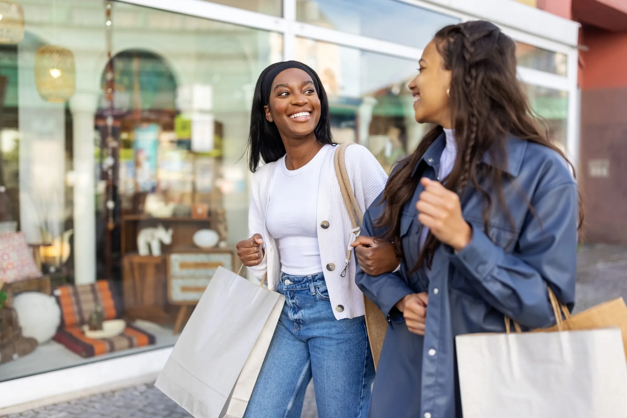 friends shopping and smiling outside modera trinity apartment homes for rent in dallas texas