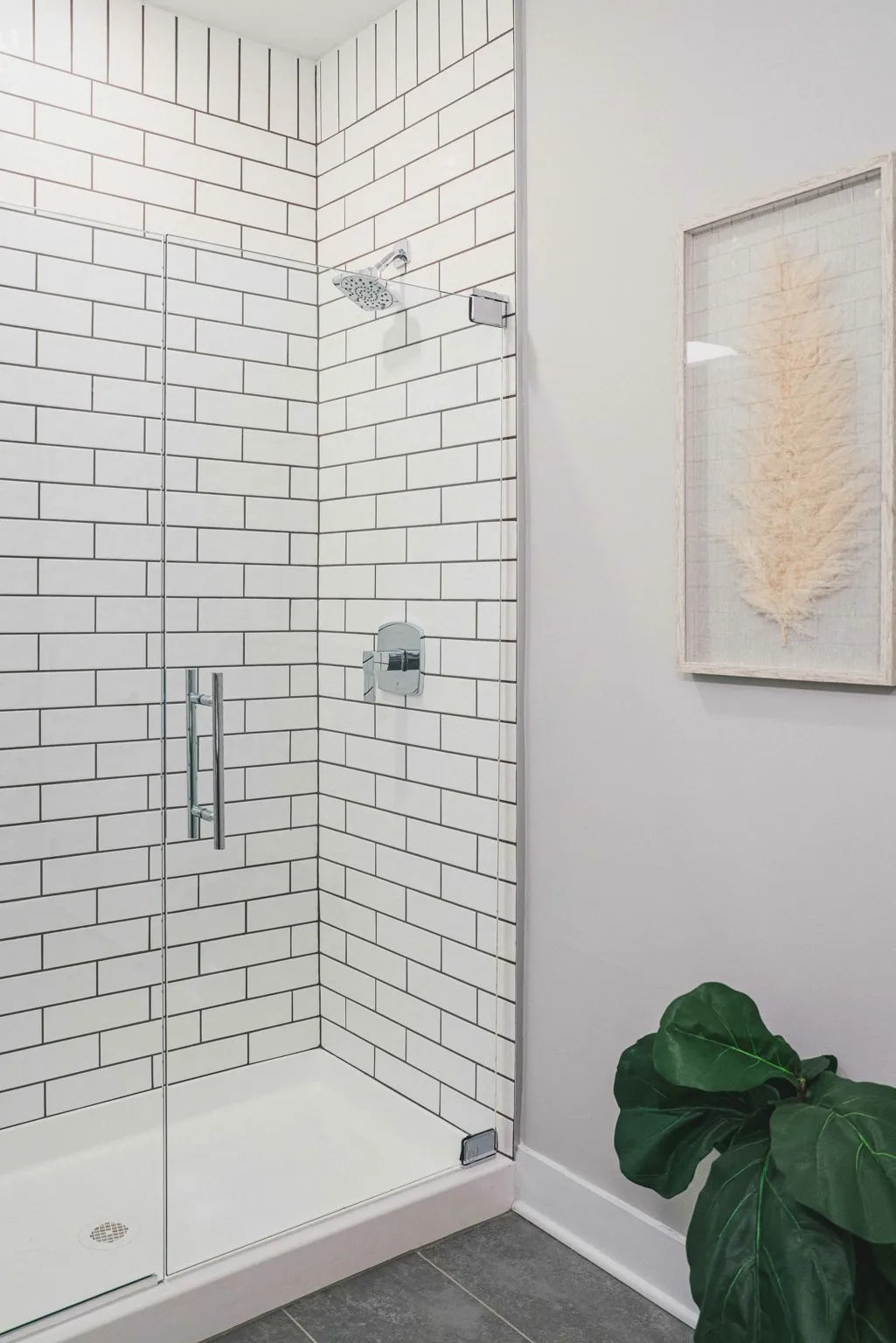 frameless glass shower with tile surrounds at modera germantown apartment homes for rent in nashville tennessee