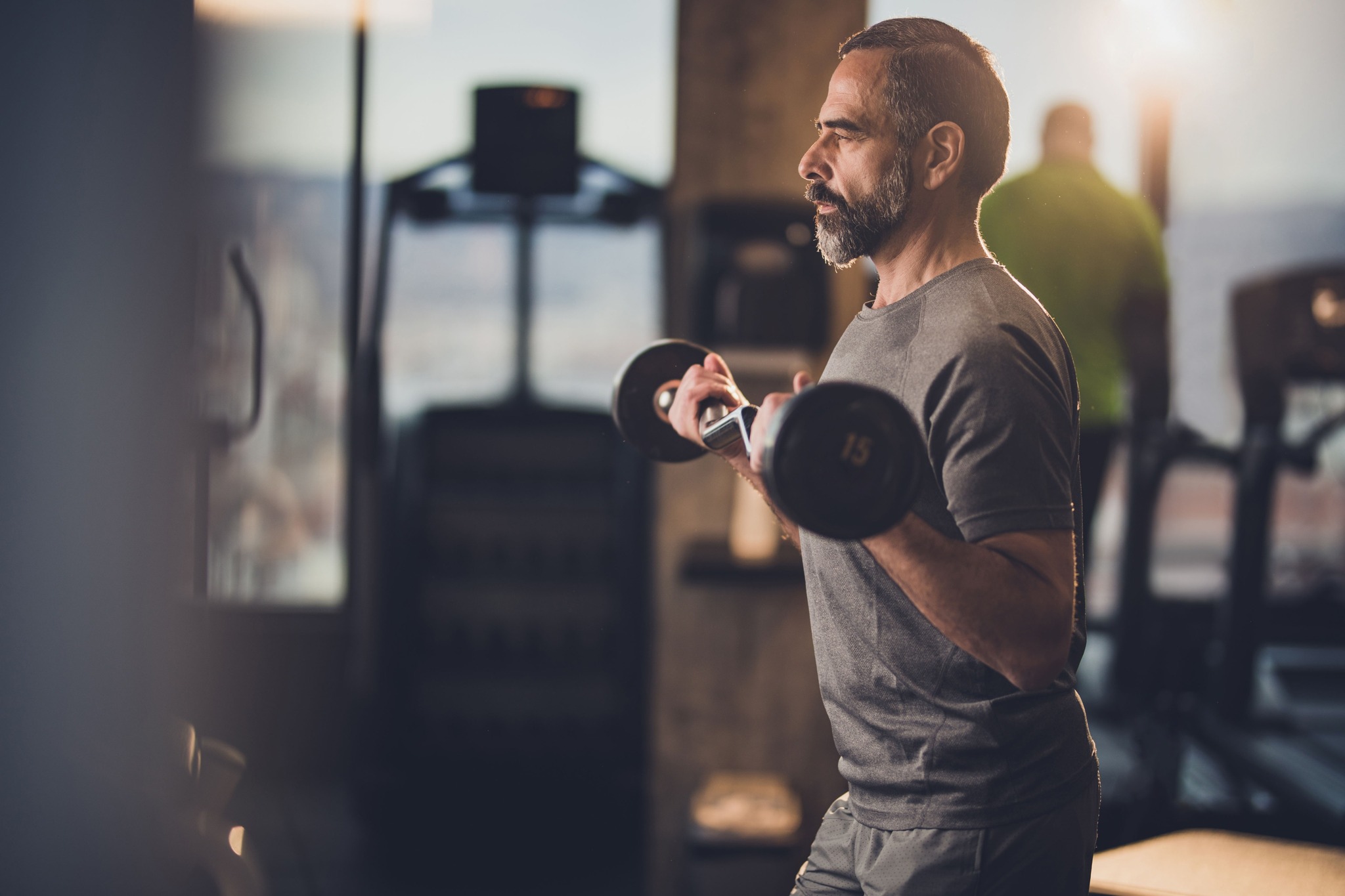 man working out in gym amavi kissimmee single family homes for rent in florida