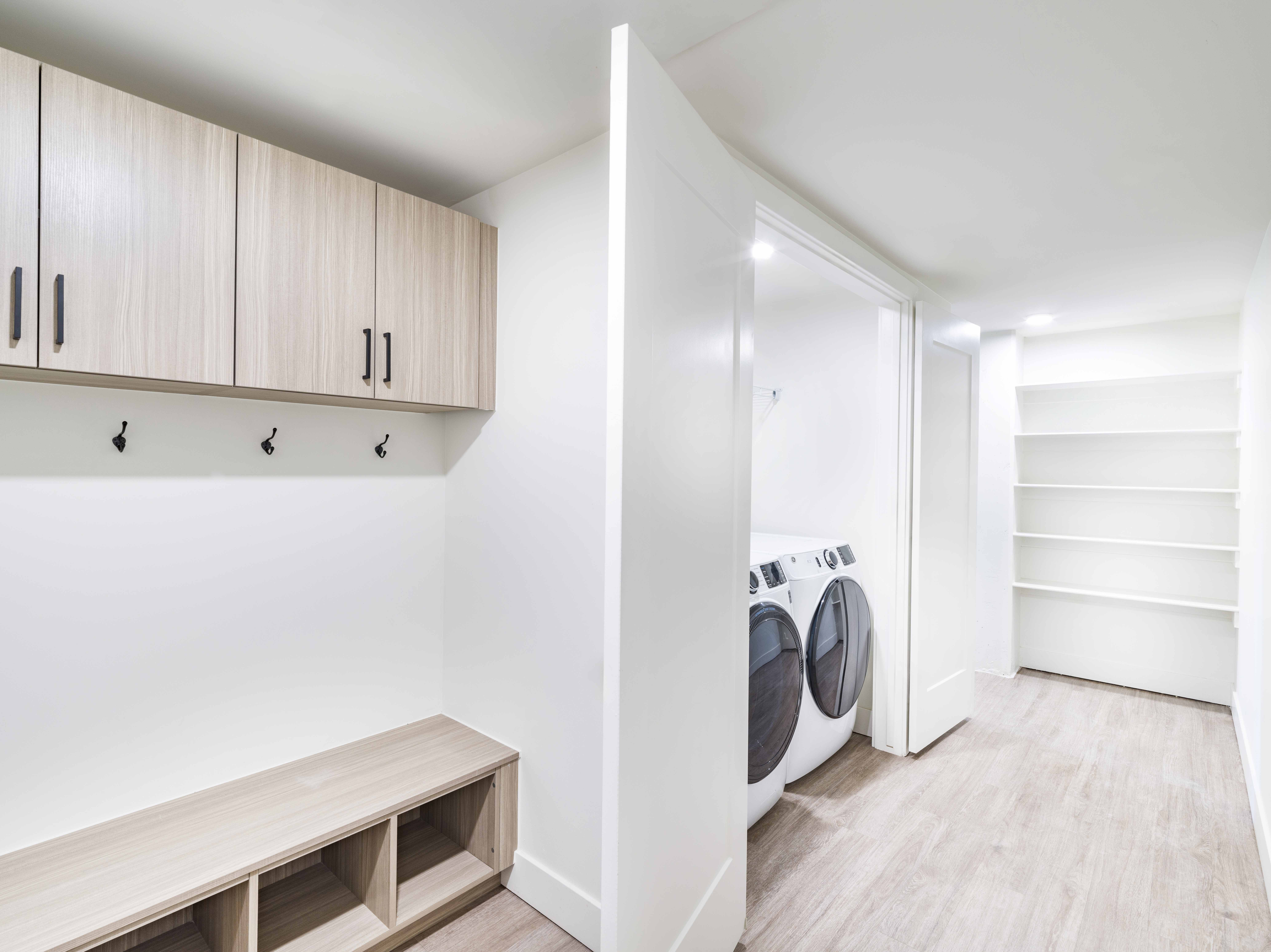 built-in storage and shelving solutions alongside in-home, full-size washer and dryer