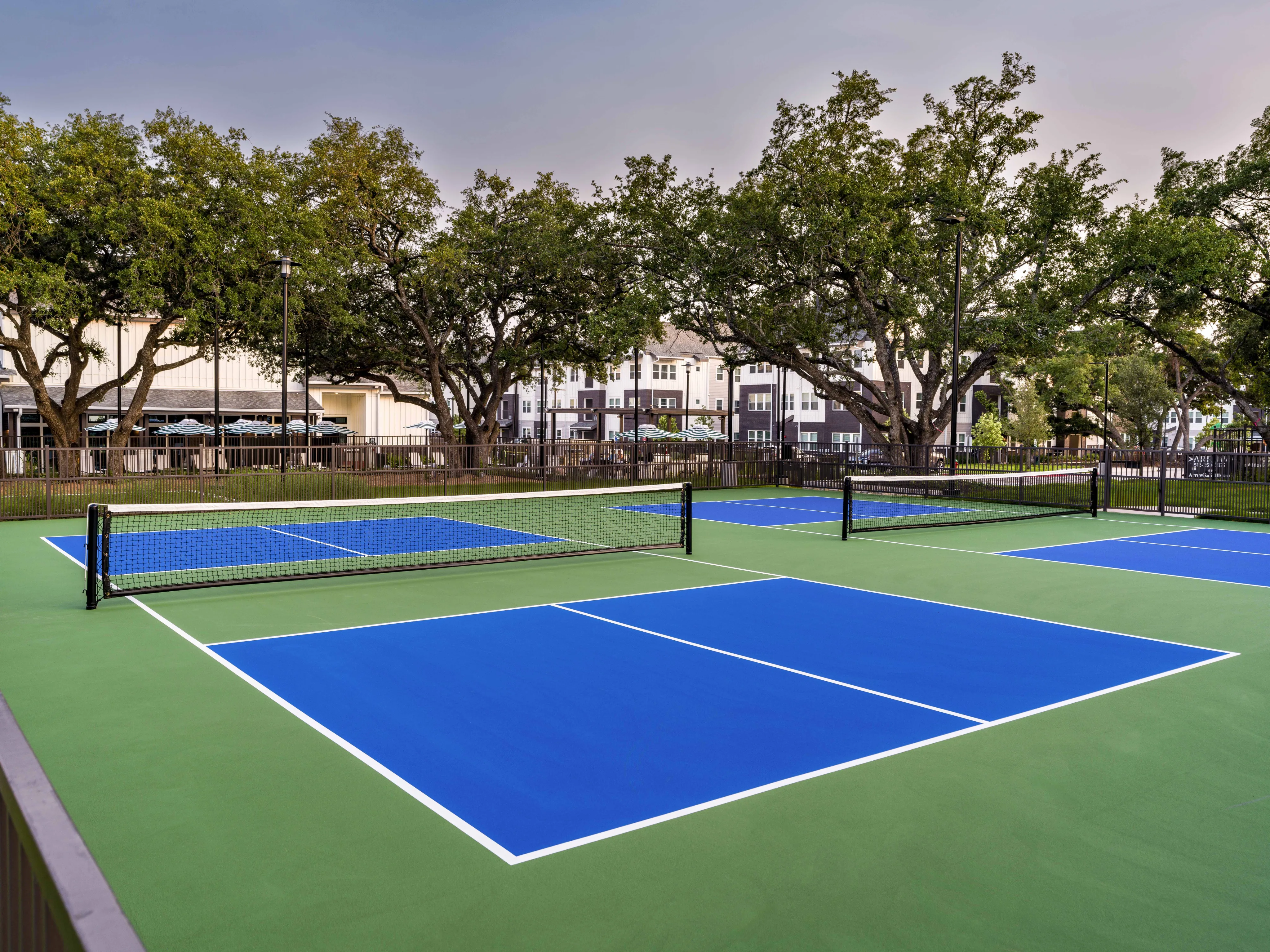 blue and green pickleball courts at modera georgetown