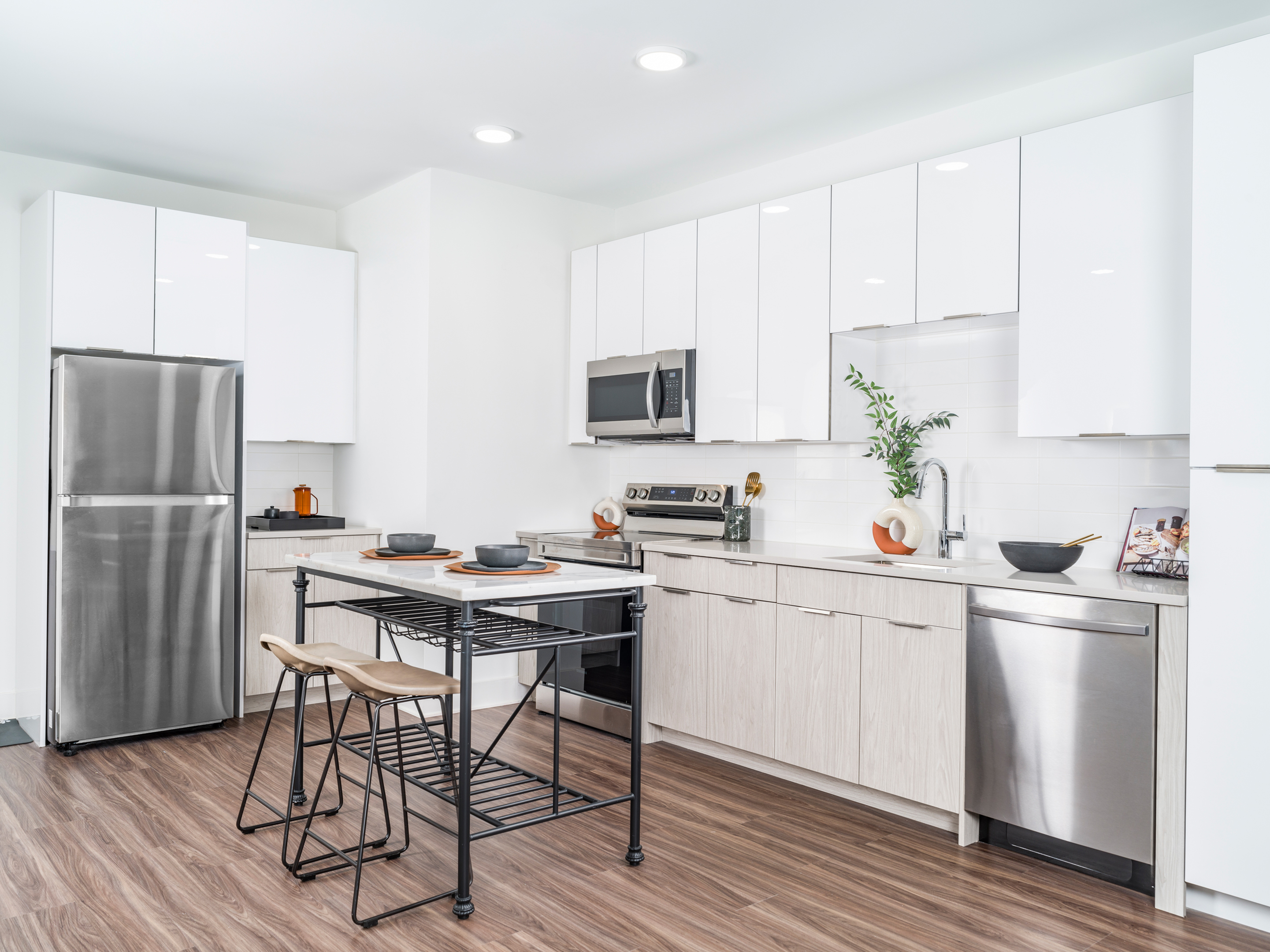 kitchen with white two toned cabinetry, stainless steel appliances