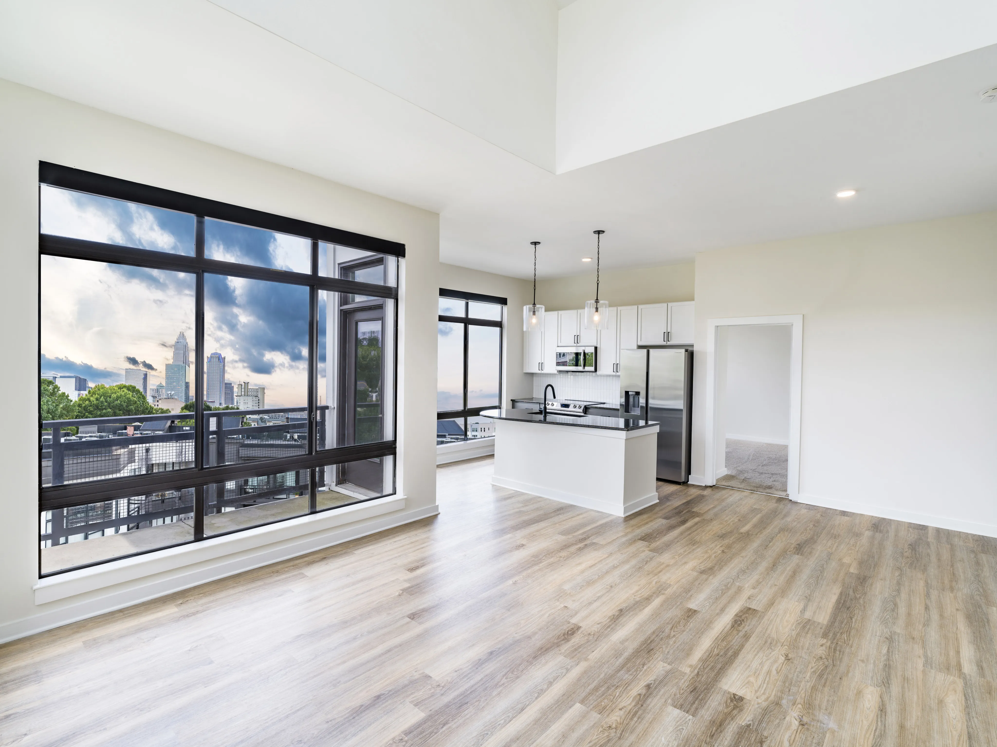 skyline view from unfurnished apartment with large widows alister uptown apartment homes for rent in charlotte nc