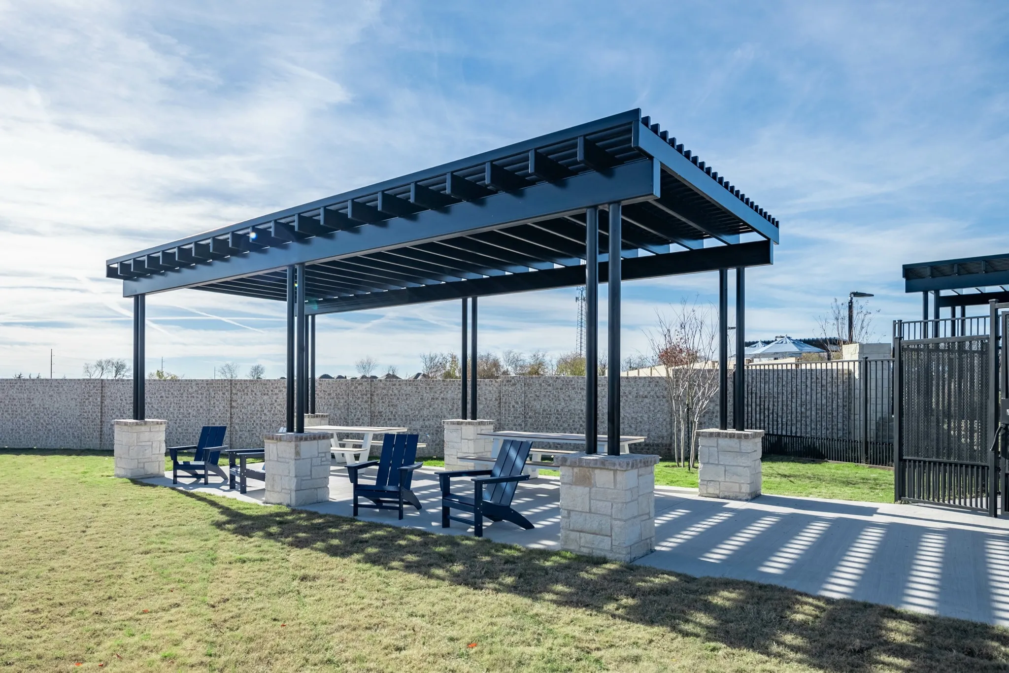 covered outdoor area with seating in pet park amavi celina single family homes for rent