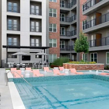 Image of woman sitting in pool