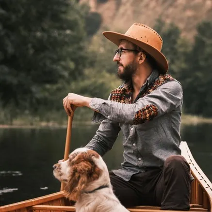 man in canoe with dog on lake modera Overlake redmond washington apartments