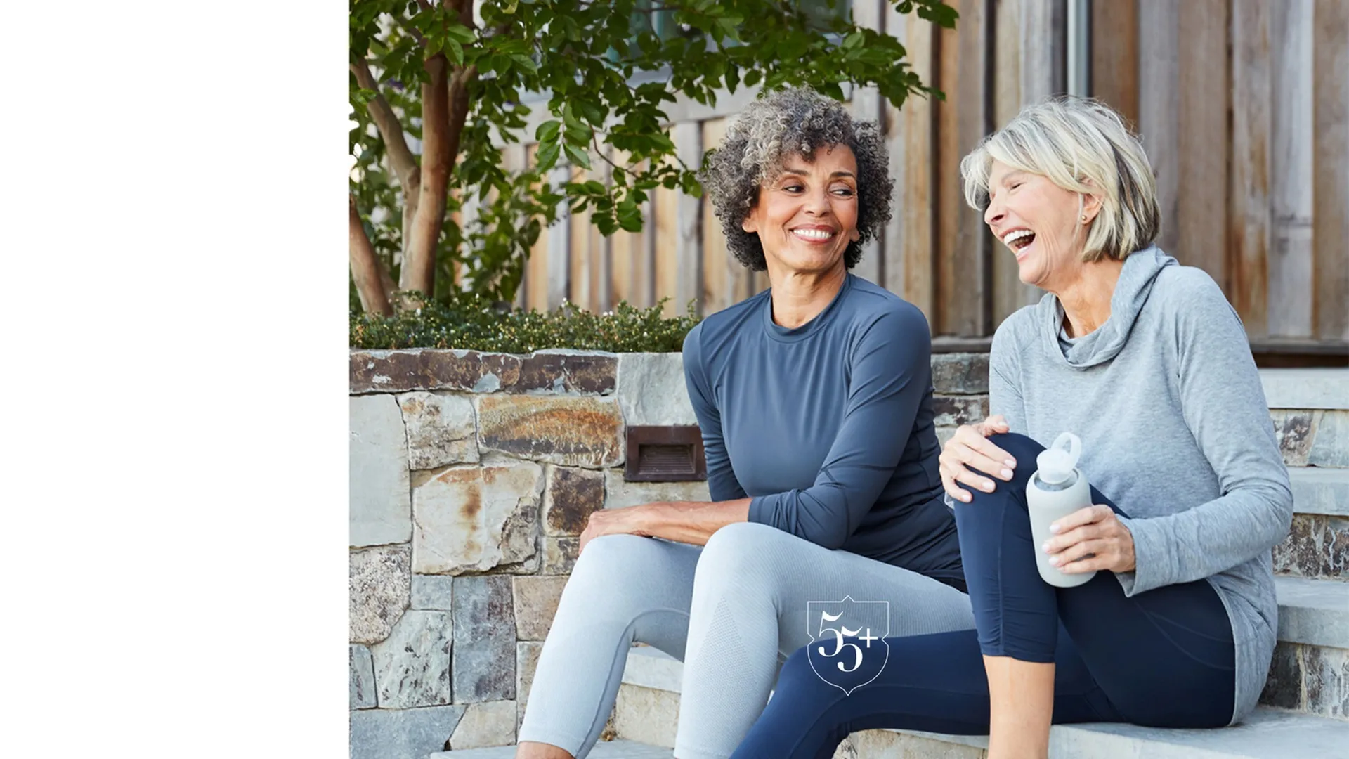 Friends in blue workout clothes laughing