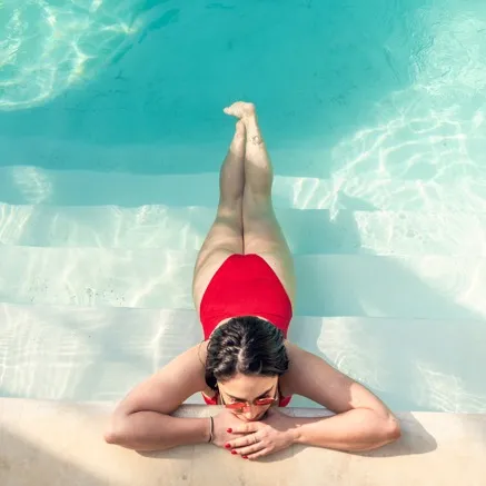 woman swimming in pool at modera berkeley heights apartments new jersey