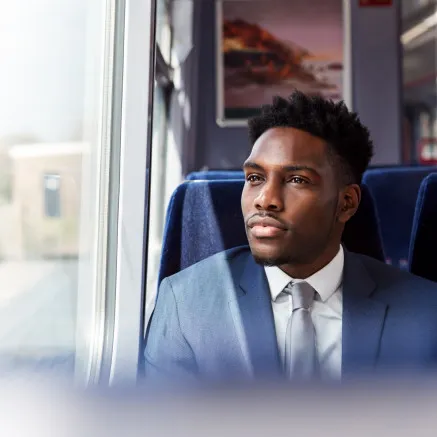 Image of man on commuter train