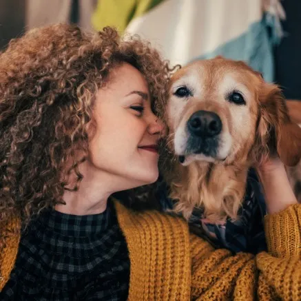 Woman and dog smiling together image