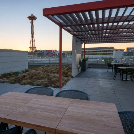 Image of Modera South Lake Union Rooftop deck with Seattle Space Needle in background