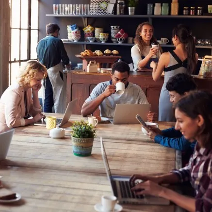 LIFE AT EASE - group of people around a table at at demo kitchen