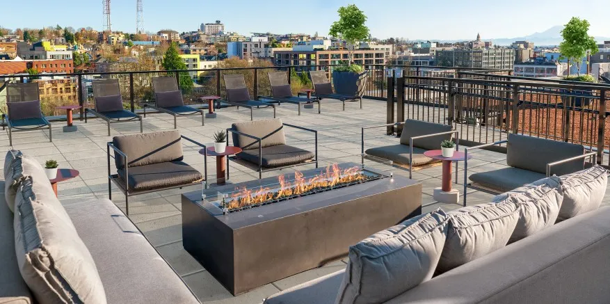Modera Broadway rooftop lounge with fireplace image