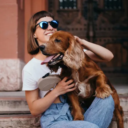 Image of owner walking dog