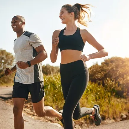 Two people running outside  - Modera San Diego Apartments
