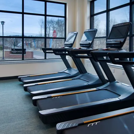 people running on treadmills in gym modera berkeley heights apartments new jersey