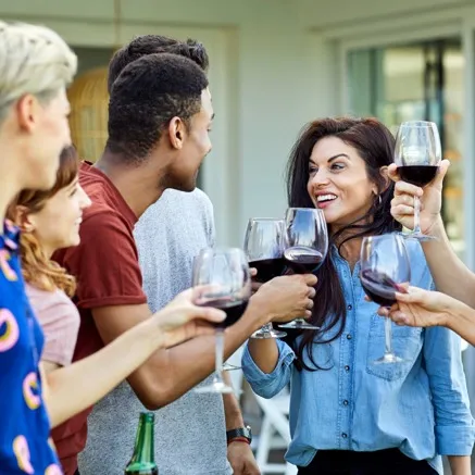 friends drinking wine together modera gulch apartment homes nashville tn