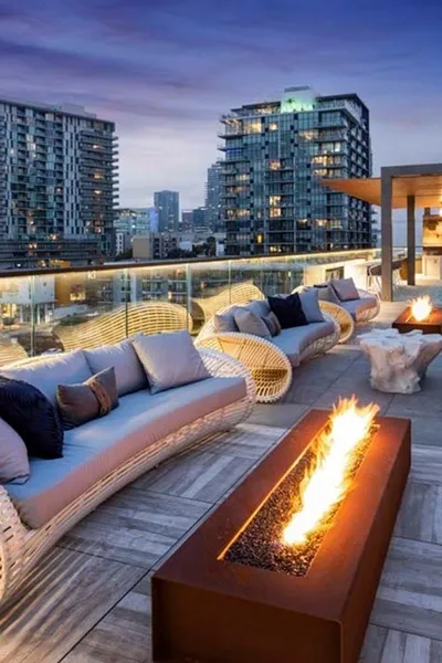 Rooftop fire place with seating a views of San Diego - Modera San Diego Apartments