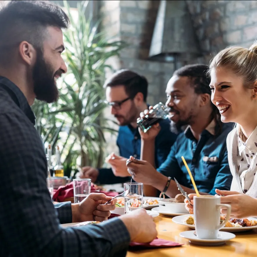 Friends eating together at restaurant
