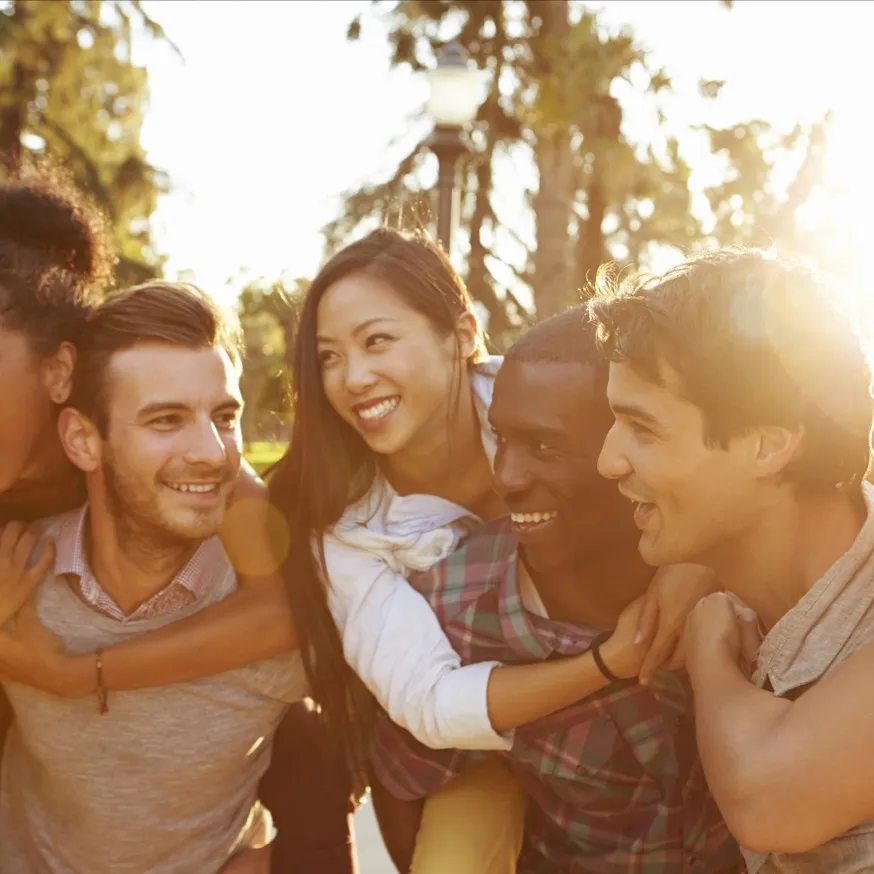 friends hugging each other at sunset modera mosaic apartment homes for rent