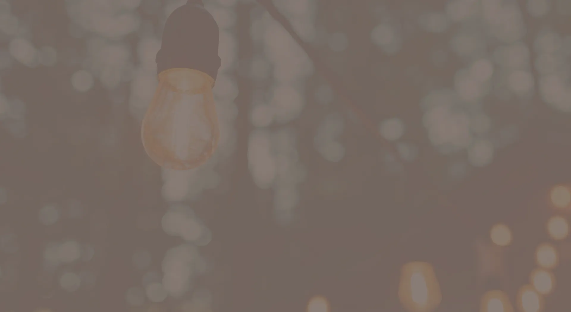 string lights at dusk with gray overlay