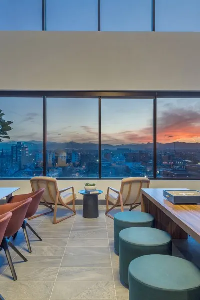 city view from amenity space at dusk modera west wash park apartment homes for rent