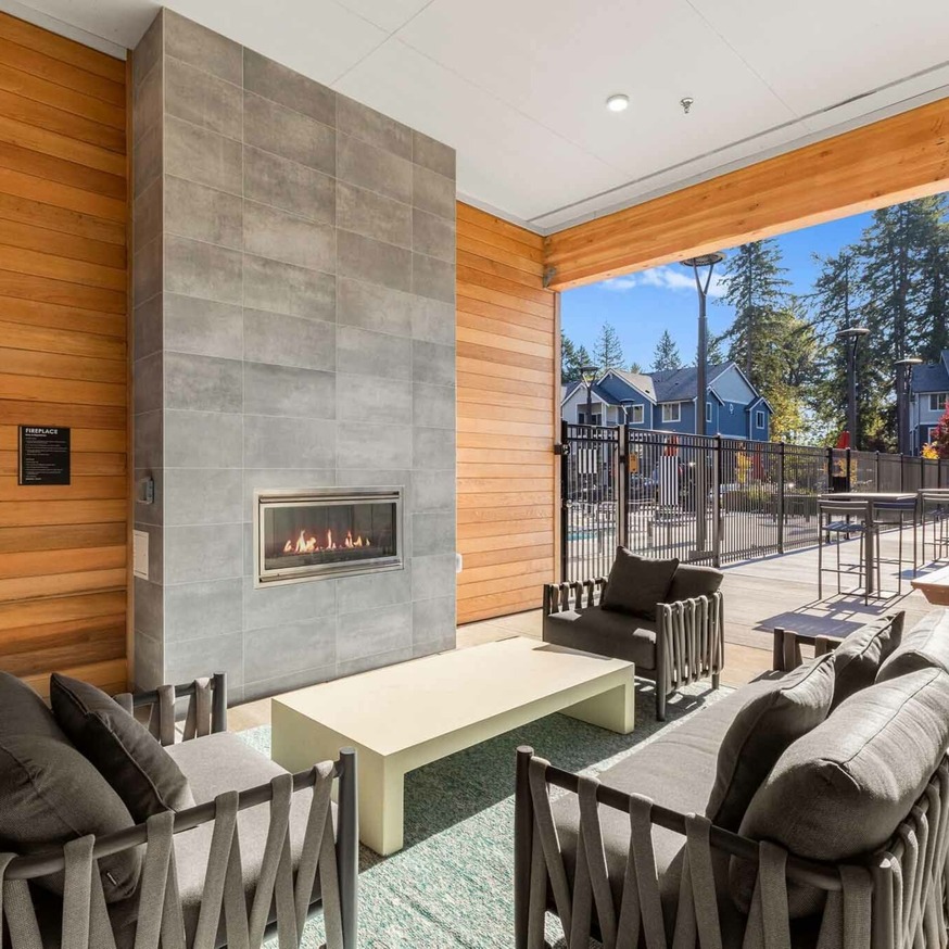 outdoor lounging area with fireplace