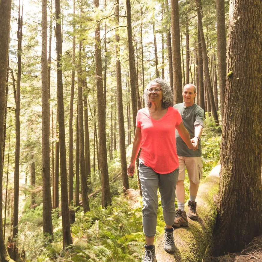 couple on hike in woods modera northgate apartment homes for rent in wa