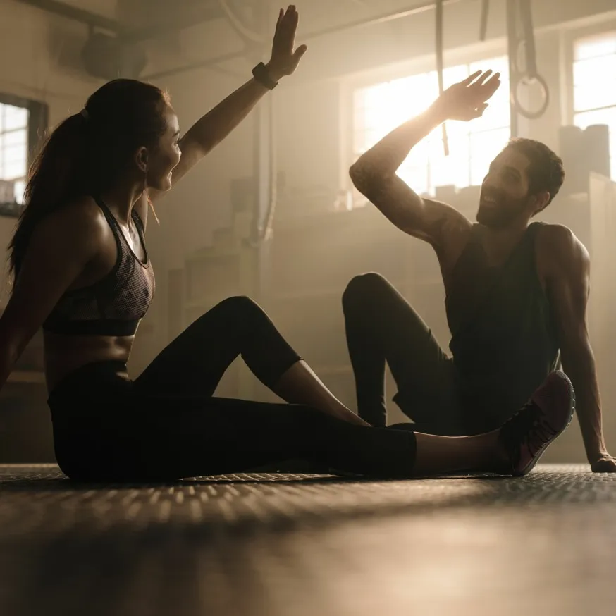 people high giving high five in the gym