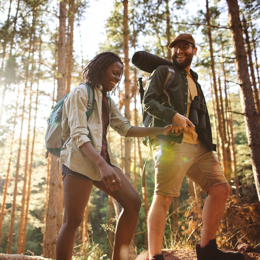 couple hiking and smiling alister sunset valley apartment homes for rent in austin tx
