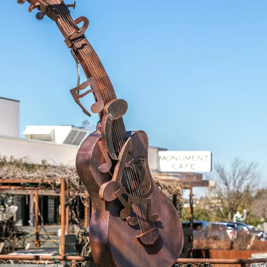 guitar statue modera georgetown apartment homes for rent