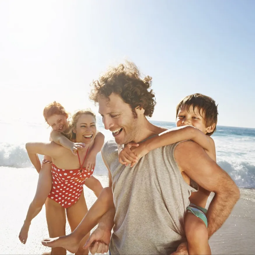family playing in ocean together modera academical village apartment homes for rent in davie fl