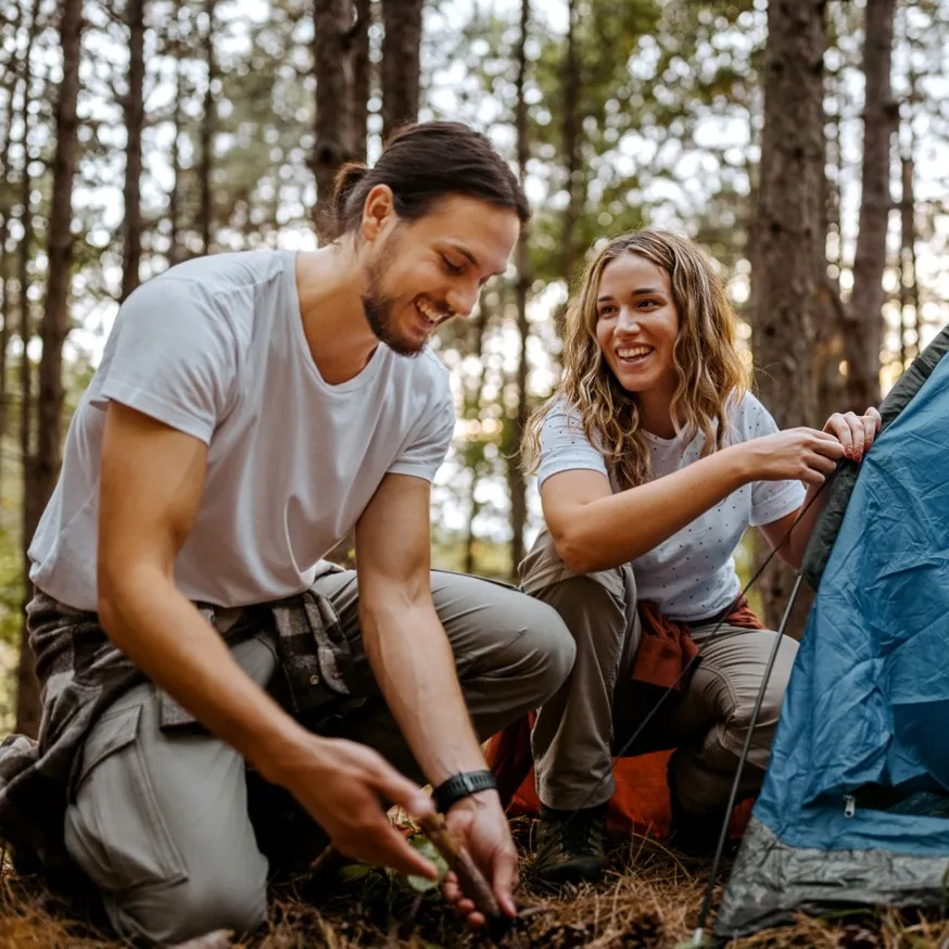 couple setting up tents in forrest beckett west fork apartment homes for rent in tx