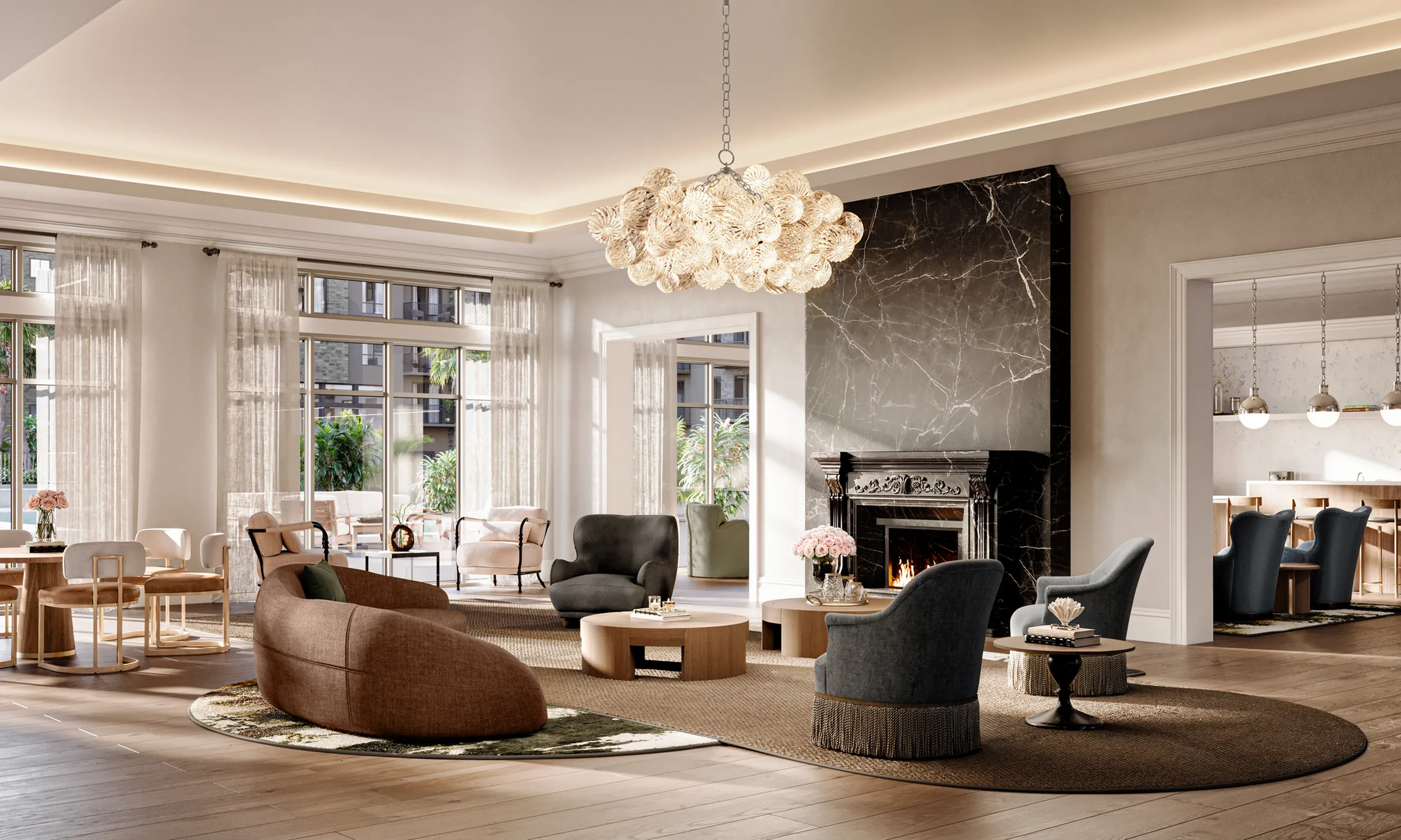 Luxurious living room with elegant chandelier, cozy fireplace, and stylish seating area, leading to a modern open kitchen.