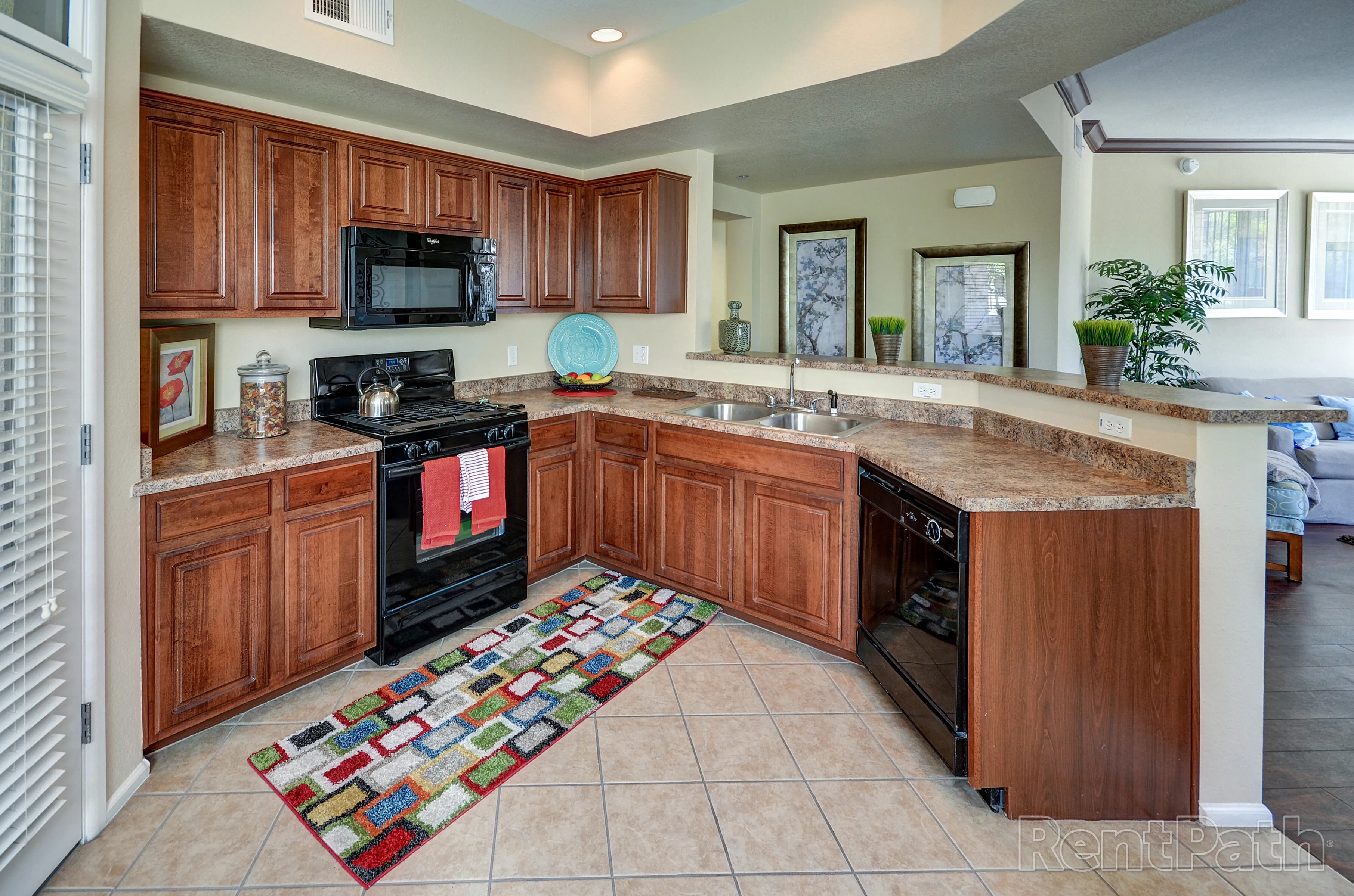 Apartment kitchen — representative home at 9920 Apartments.
