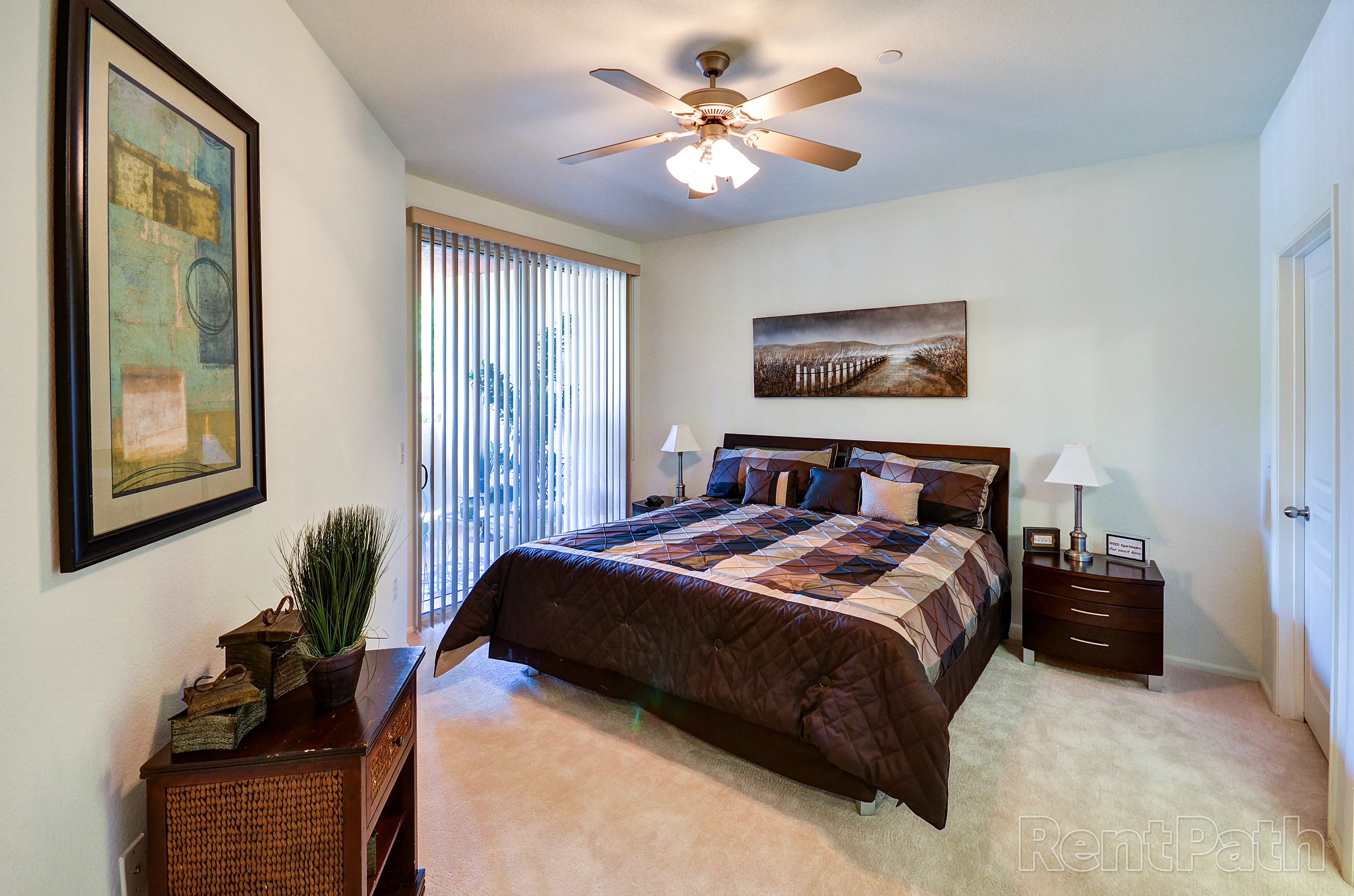 Furnished bedroom shown — representative home at 9920 Apartments.