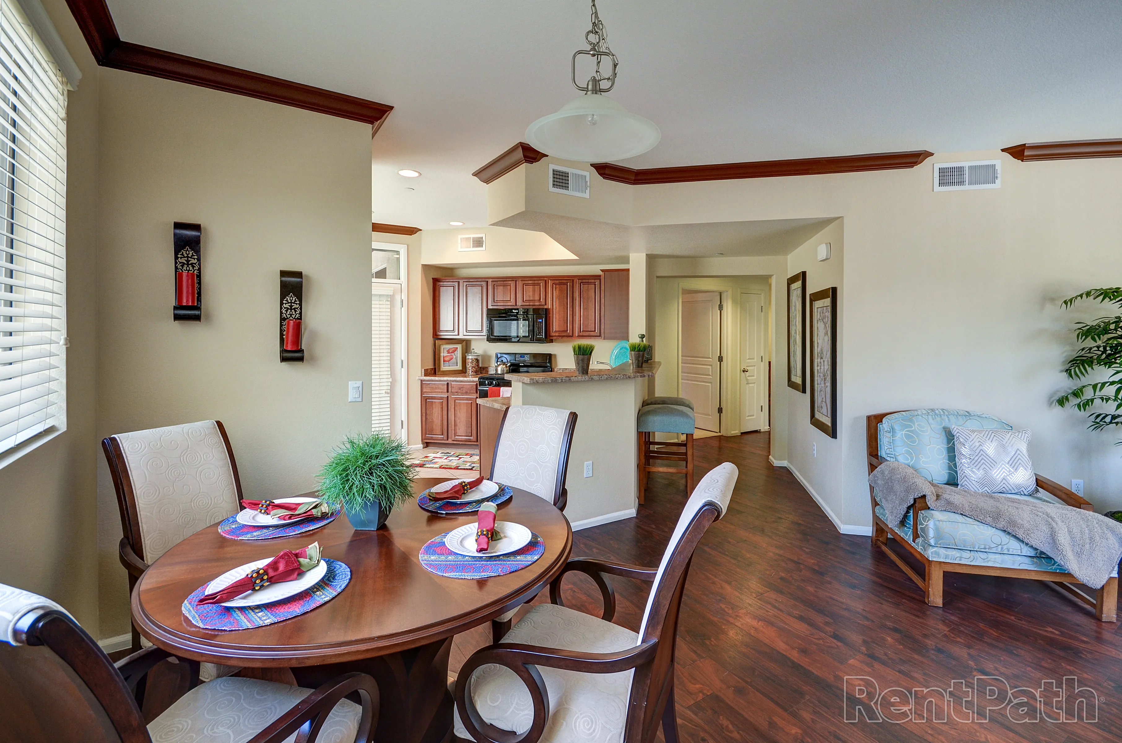 Furnished dining area shown — representative home at 9920 Apartments.