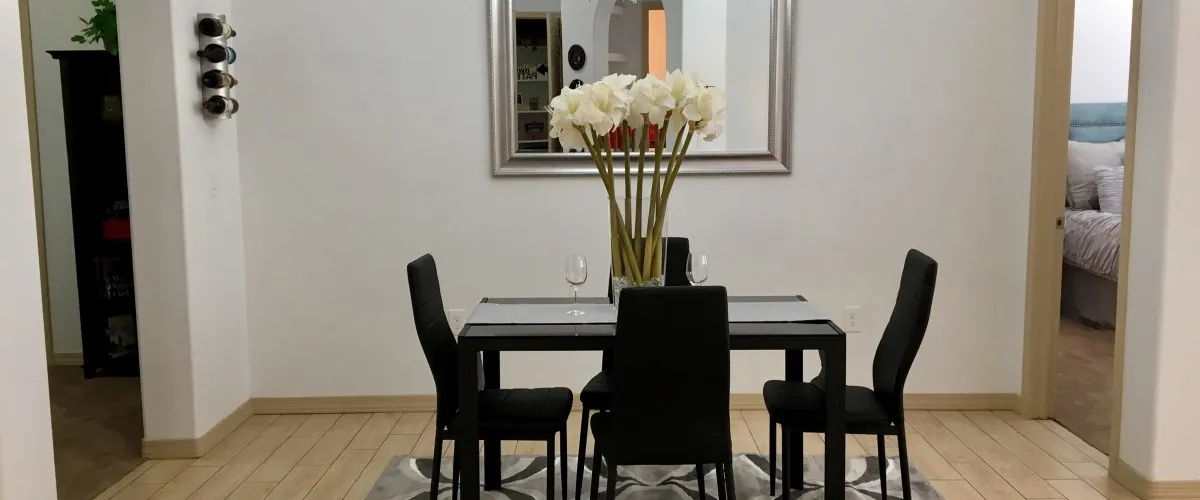 Furnished dining area shown — representative home at 9920 Apartments.
