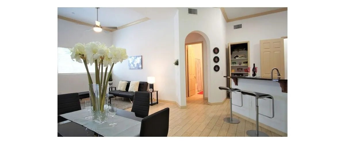 Furnished apartment living area shown — representative home at 9920 Apartments.