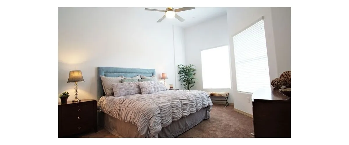 Furnished bedroom shown — representative home at 9920 Apartments.