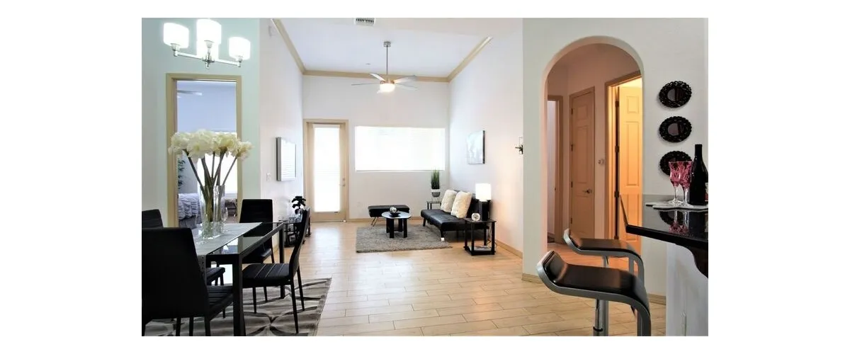 Furnished apartment living area shown — representative home at 9920 Apartments.