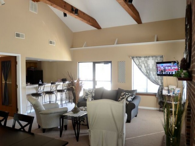 Clubhouse at Cambridge with multiple seating areas and TV