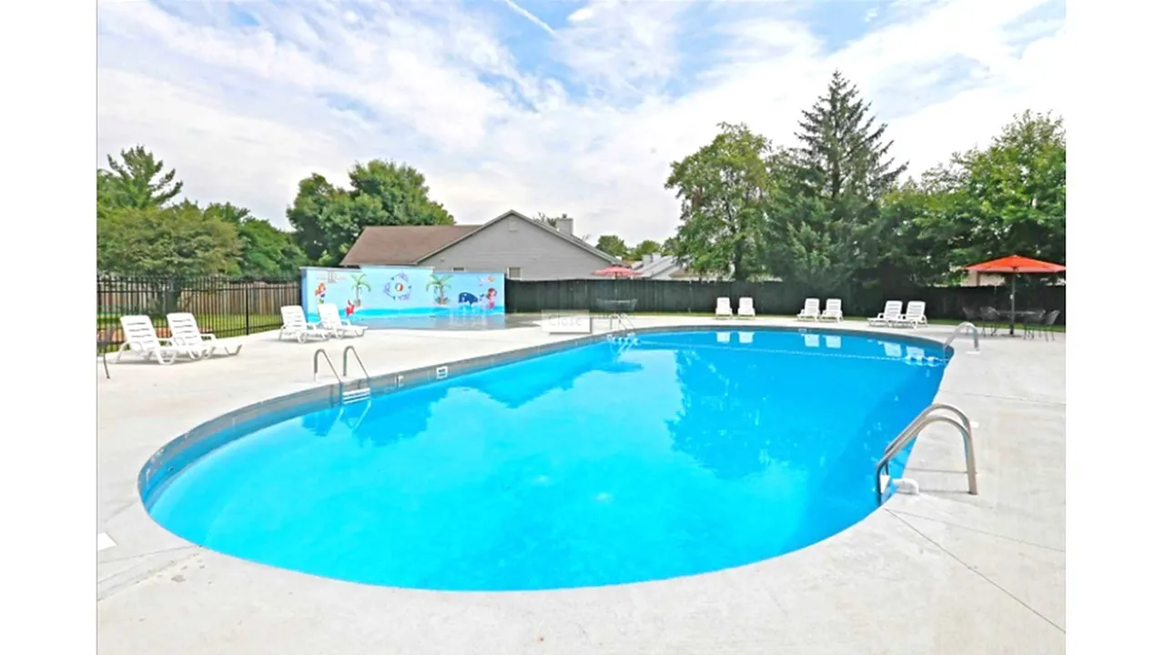 Sparkling pool with sun chairs surrounding