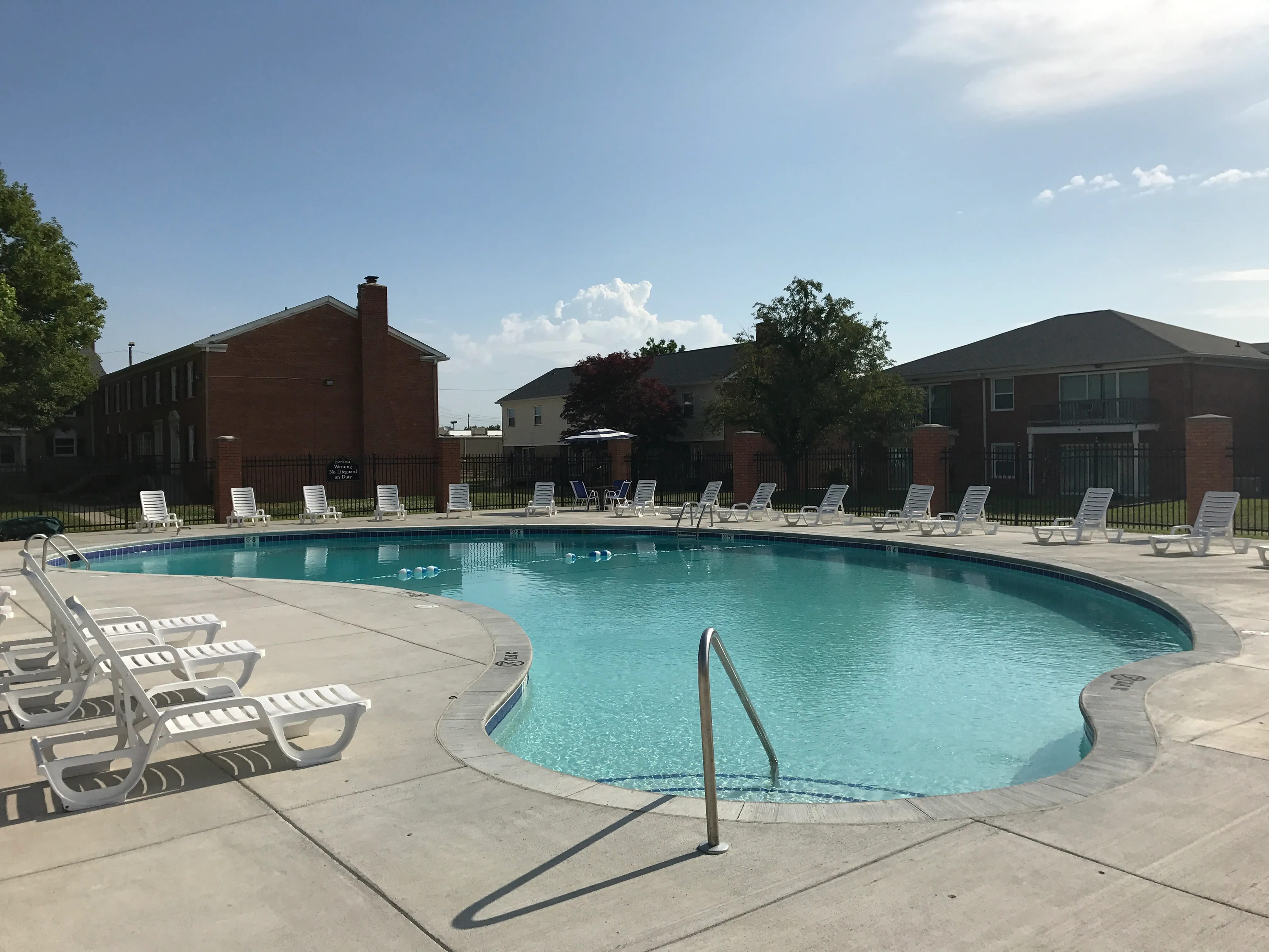 Sparkling pool with sun chairs surrounding
