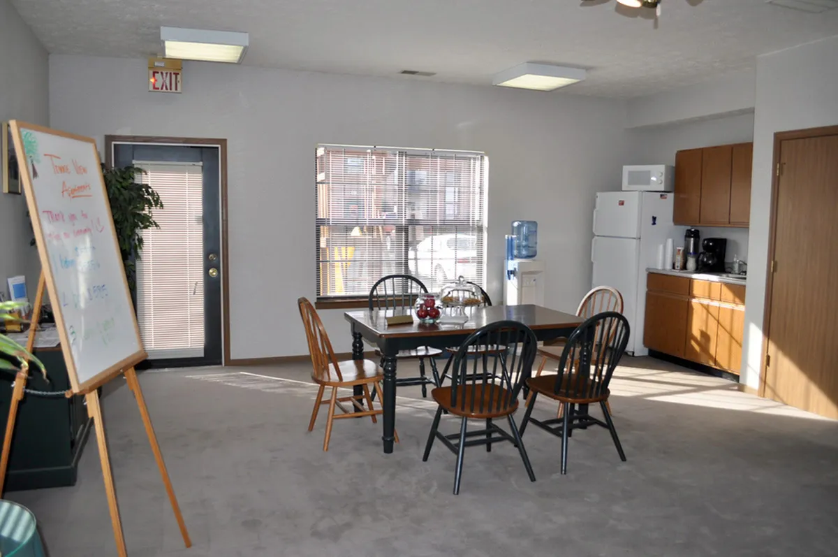 Community center with large table and coffee area