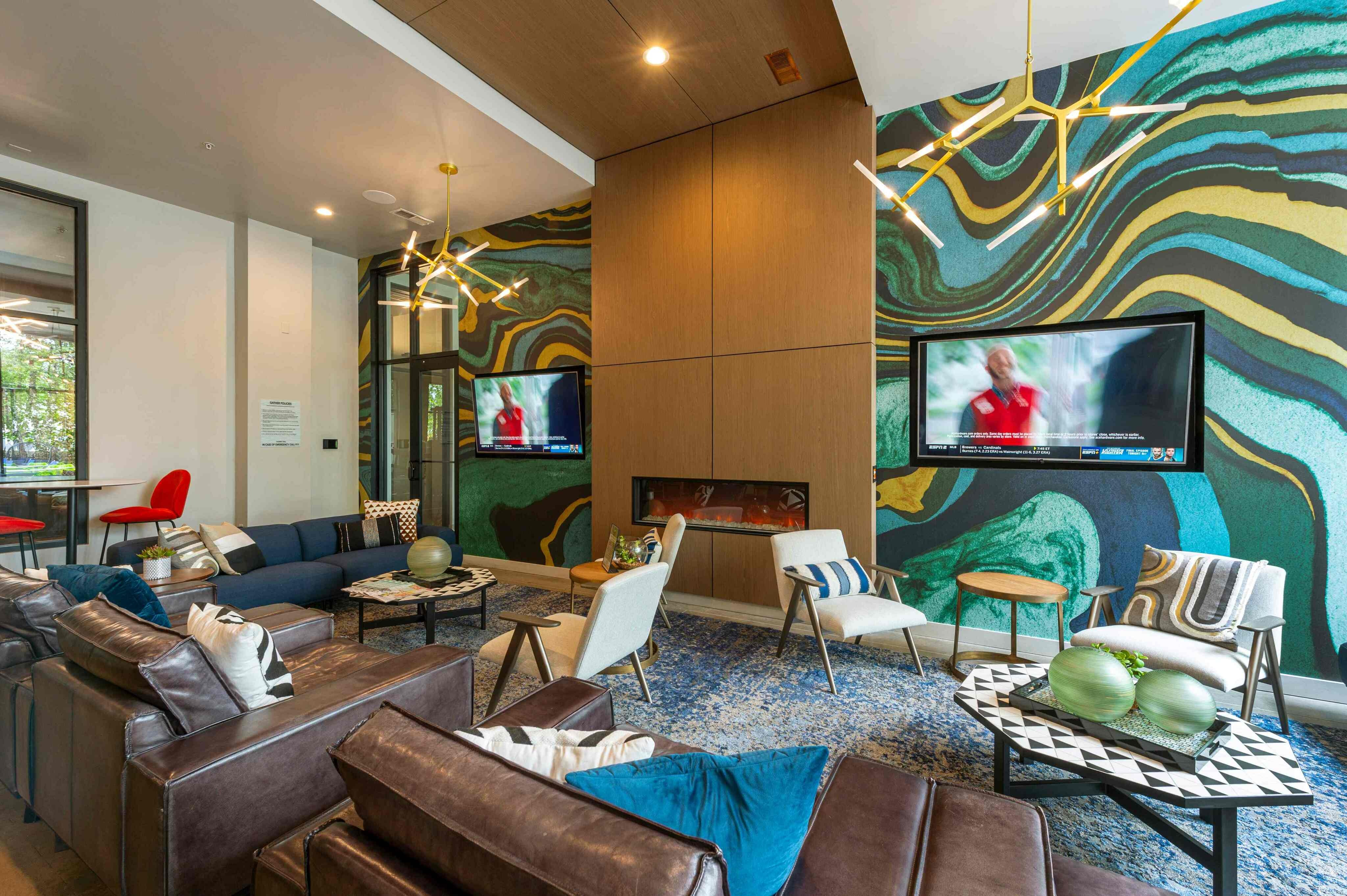Resident social lounge with TVs, pool table, shuffleboard
