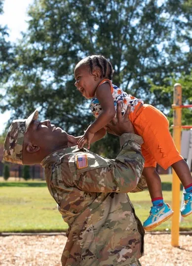 Military soldier with child