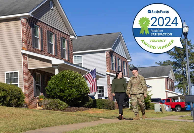 Smiling couple walking in military community