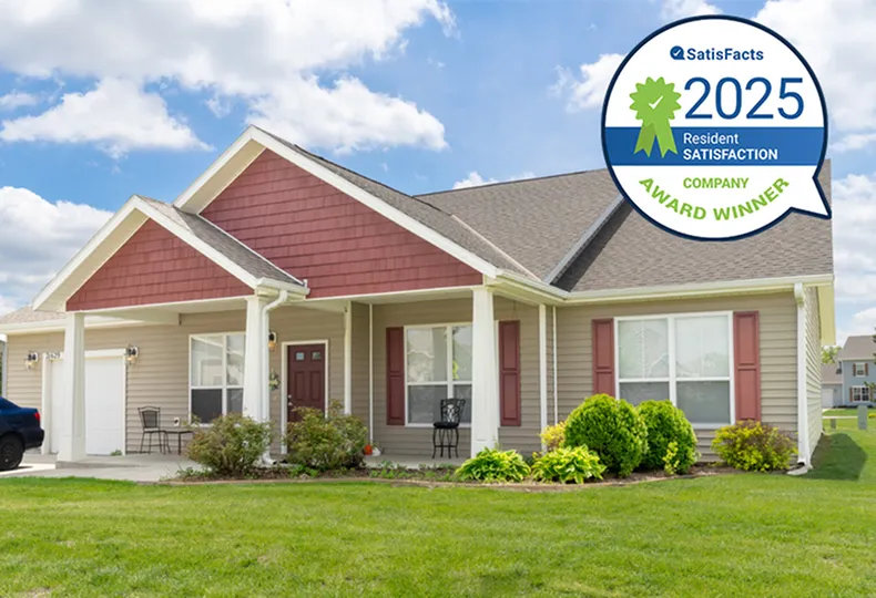 Charming single-story home with a welcoming front porch, lush landscaping, and award for resident satisfaction 2024.